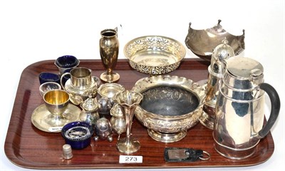 Lot 273 - Assorted silver items to include: a hot water jug, Sheffield 1911; a repousse decorated...
