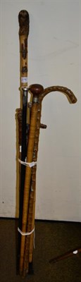 Lot 276 - Two silver topped walking canes; a bamboo sword stick, circa 1900; and five other sticks (8)