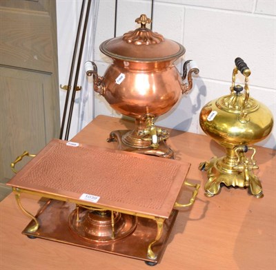 Lot 1039 - A copper samovar, a brass kettle and a copper food warmer (3)