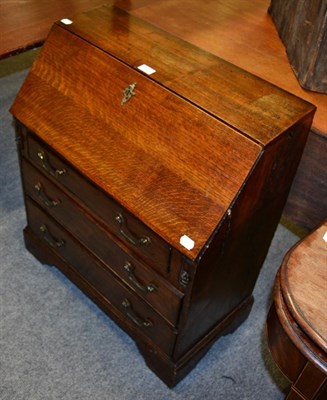 Lot 1050 - An oak bureau of small proportions