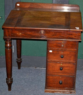 Lot 1059 - A clerks desk with a pedestal base and two turned legs