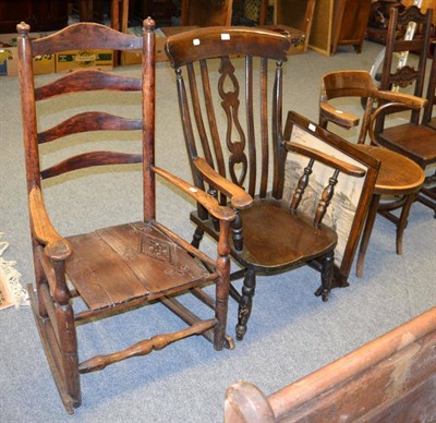 Lot 1062 - A ladder back rocking chair, a 20th century Windsor armchair, another armchair and a fire...