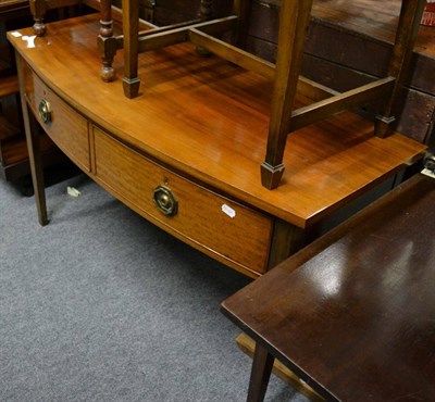 Lot 1071 - A 19th century mahogany bow fronted side table with two drawers