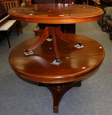Lot 1084 - A mahogany circular breakfast table and an oval shaped reproduction coffee table (2)