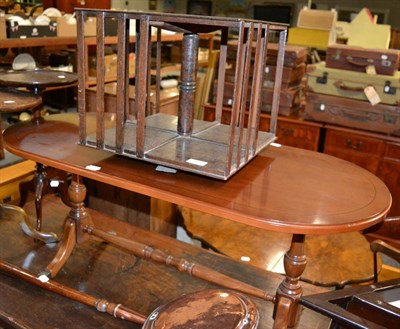 Lot 1095 - An Edwardian revolving bookcase and a clothes rack