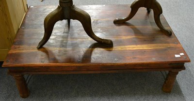 Lot 1099 - A reproduction coffee table