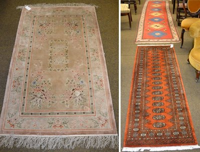 Lot 1170 - Narrow Kozak runner, west Anatolia, the tomato field with a column of hooked medallions enclosed by