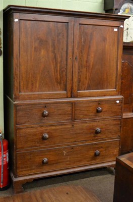 Lot 1195 - A mahogany linen press the base with two long drawers and two short drawers, early 19th century