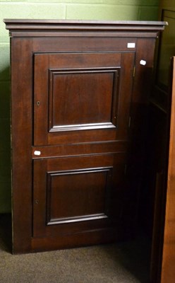 Lot 1202 - A mahogany corner cupboard