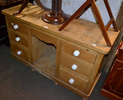 Lot 1211 - A pine low dresser comprising six drawers