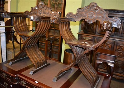 Lot 1217 - A pair of 20th century carved alter chairs