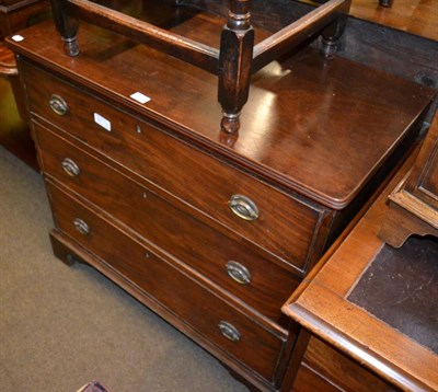 Lot 1225 - An early 19th century mahogany three height chest of drawers