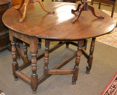 Lot 1236 - An 18th century oak gateleg table