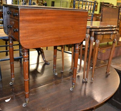 Lot 1239 - A nest of tables and a Victorian drop leaf table with two side drawers