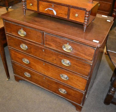 Lot 1244 - An early 19th century mahogany chest of drawers comprising three long drawers and two short drawers