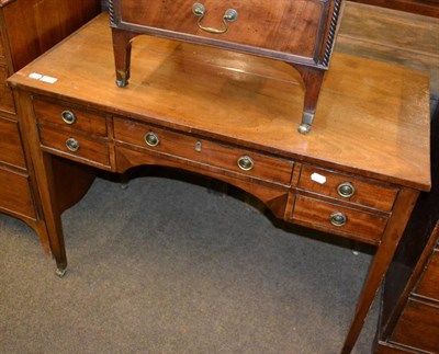 Lot 1246 - A 19th century mahogany side table containing a central long drawer and four side drawers