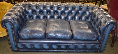 Lot 1260 - A three seater leather Chesterfield sofa