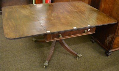Lot 1267 - An early 19th century mahogany drop leaf table with a central single drawer, raised upon castor...