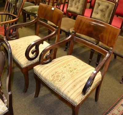 Lot 1274 - A pair of mahogany armchairs with saber shaped legs