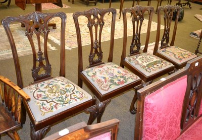 Lot 1279 - Four mahogany George III style dining chairs, multi coloured tapestry seats, raised upon claw...