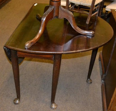 Lot 1286 - A mahogany drop leaf table raised upon pad feet, early 19th century and later