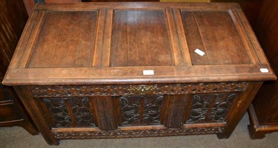 Lot 1296 - An 18th century style carved oak coffer