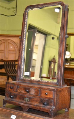 Lot 1304 - An 18th century parcel gilt walnut toilet mirror