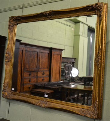 Lot 1321 - A reproduction over mantle mirror with gilt decorated frame