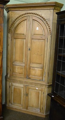 Lot 1323 - An 18th century style large pine corner cupboard