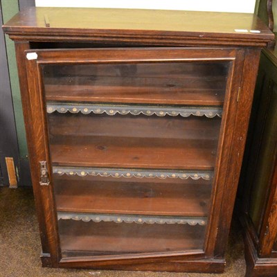 Lot 1328 - A late 19th century glazed oak bookcase comprising four internal shelves