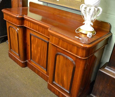 Lot 1332 - A Victorian mahogany pedestal sideboard comprising three drawers with three cupboards below