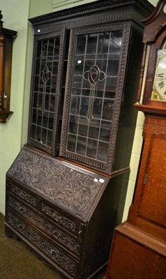 Lot 1335 - A carved secretaire bookcase, later top
