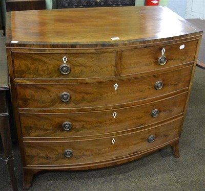 Lot 1342 - A 19th century mahogany bow fronted chest of drawers comprising three long drawers with two shorter