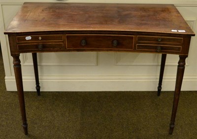 Lot 1345 - A 19th century mahogany inverted bow fronted side table comprising of a central drawer and...