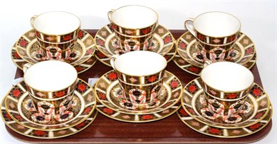 Lot 1 - A set of six Royal Crown Derby Imari tea cups, saucers and side plates