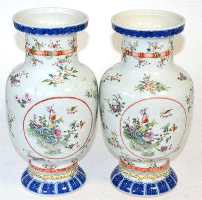 Lot 19 - A pair of Chinese Wucai style porcelain vases