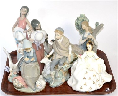 Lot 26 - A Lladro girl with geese group; together with six other Lladro figures and a Royal Doulton 'My...