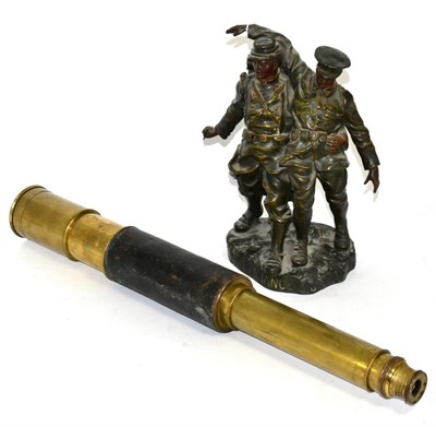 Lot 32 - An early 20th century bronzed spelter First World War group 'L'alliance' and a brass telescope (2)