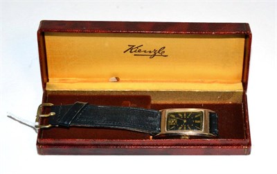Lot 54 - A 9 carat gold curved rectangular wristwatch