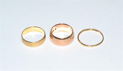 Lot 65 - Three 9 carat gold band rings, finger size M1/2, Q and T1/2