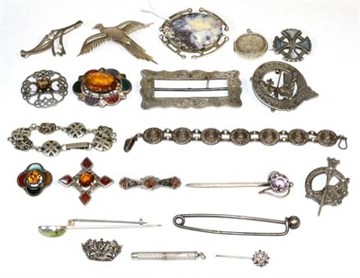 Lot 79 - Nine various Scottish hardstone and paste brooches; a silver plaid brooch; a silver buckle...