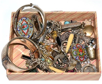 Lot 83 - Two silver hinge opening bangles; five Victorian brooches; ten various charms; a silver cigar...