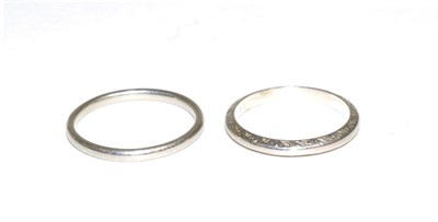 Lot 86 - Two band rings, one with chased decoration, finger size O and M, each stamped 'PLATINUM' (2)