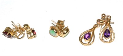 Lot 104 - A pair of 9 carat gold cabochon jade earrings; a pair of garnet and diamond drop earrings,...
