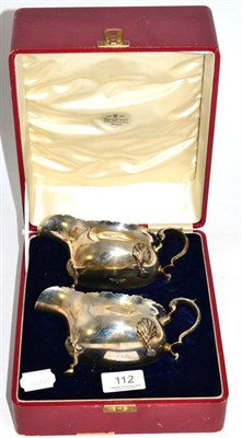 Lot 112 - A cased pair of silver sauce boats by Davis Duff & Sons, Glasgow and with marks for Birmingham 1936