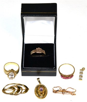 Lot 168 - A 9 carat gold mouring ring, with a central shield shaped cartouche and the shank with plaques...