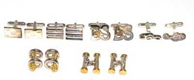 Lot 171 - A pair of cufflinks in the shape of a treble clef, with hinged bars; together with five further...