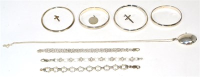 Lot 174 - Four silver bangles, two hinged; three fancy link silver bracelets, lengths 19cm, 19cm and...