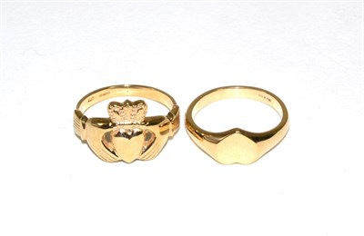 Lot 180 - A 9 carat gold Claddagh ring, finger size T and a 9 carat gold heart shaped signet ring, finger...