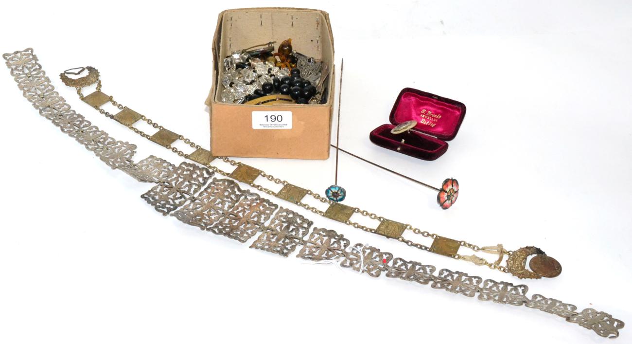 Lot 190 - Two enamelled rose hat pins, length 26cm and 28cm; an EPNS link belt, length 73.5cm; an...